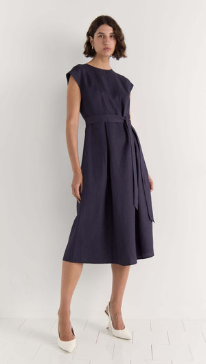 Rhea Midi Dress in deep navy, sleeveless style with self-tie belt, showcasing a midi length and elegant cap sleeves.