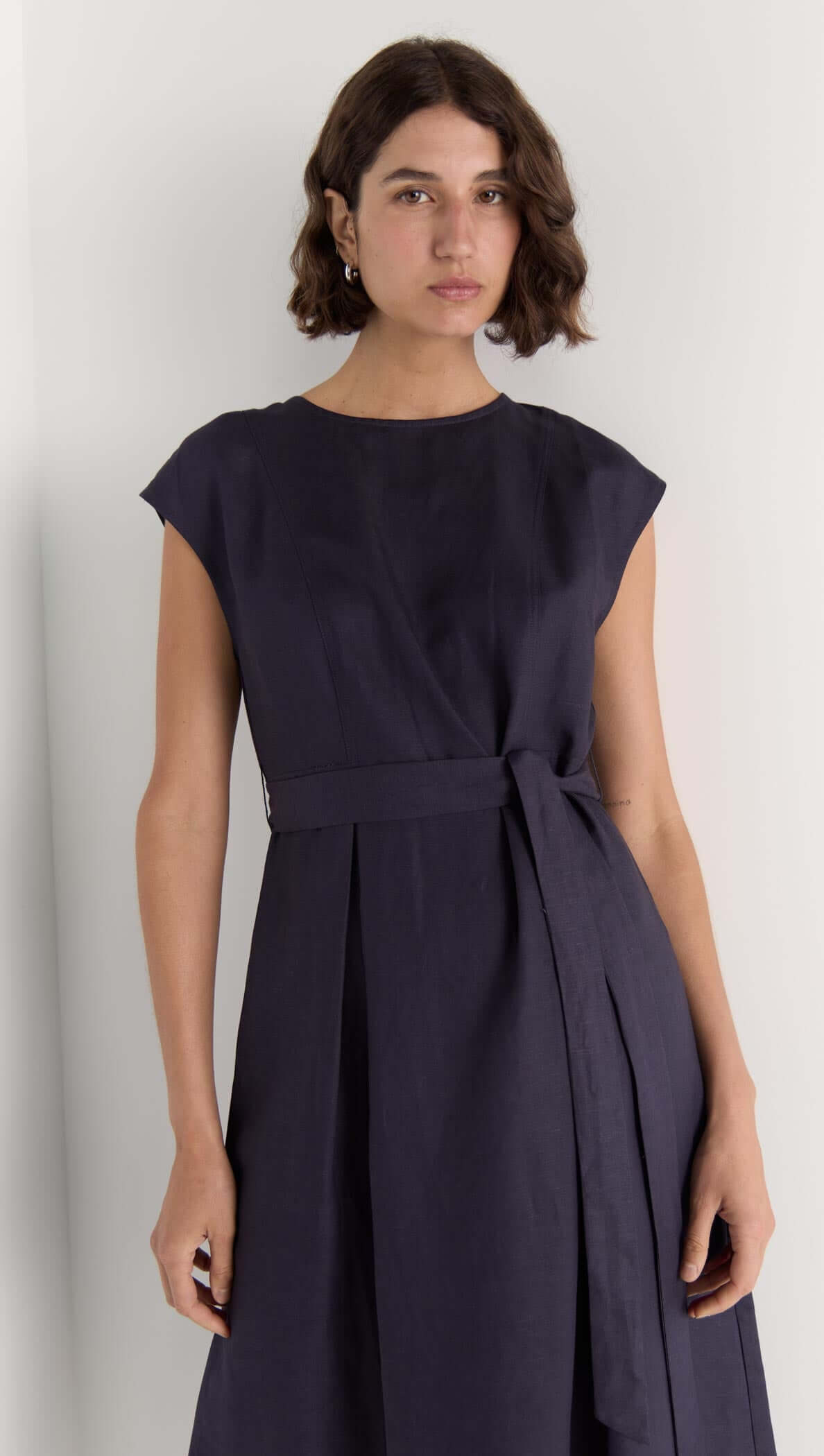 Rhea Midi Dress in deep navy, featuring cap sleeves and self-tie belt, made from breathable linen-viscose blend.