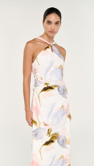 Pastel Watercolour Cotton Midi Dress with Halter Neck model wearing a floral dress featuring soft colors and a halter neck design.