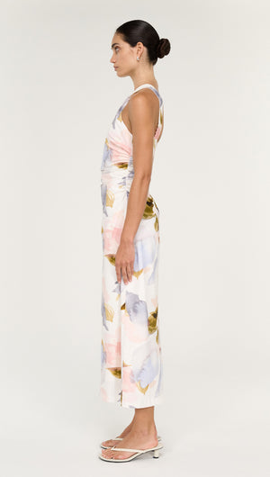 Pastel Watercolour Cotton Midi Dress with Halter Neck displayed on a model in a side view, showcasing its elegant silhouette and floral print.