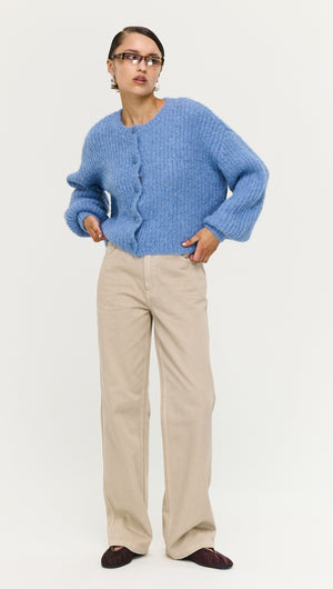 Soft Handle Ballon Sleeve Cardigan in Blue worn with beige pants and styled for a casual look.