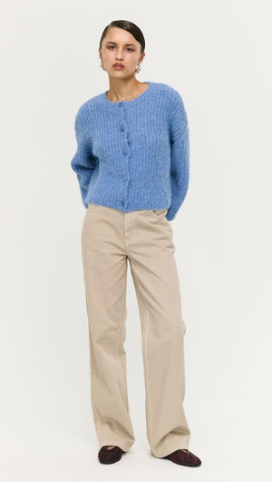 Soft Handle Ballon Sleeve Cardigan in Blue worn with beige pants and styled for a casual look.