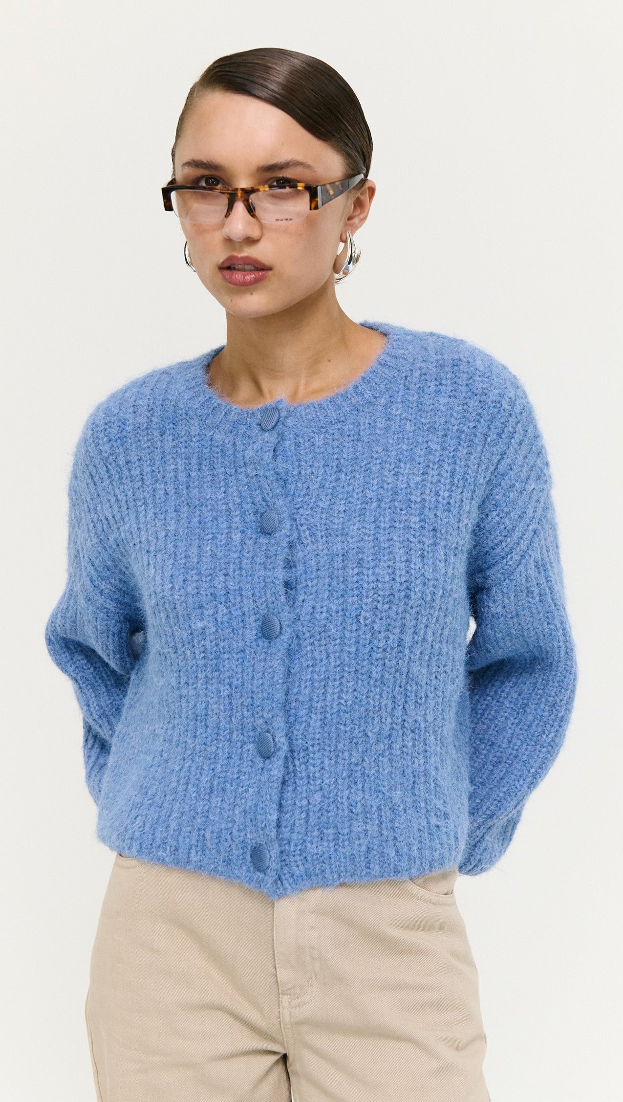 Soft Handle Ballon Sleeve Cardigan in Blue worn by model, featuring button details and a fluffy texture.