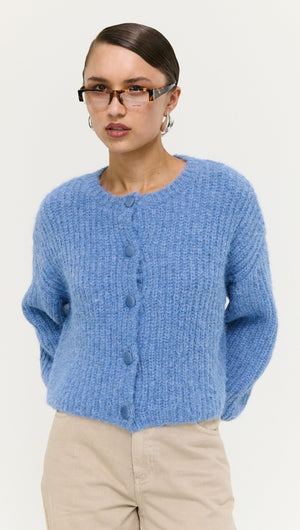 Soft Handle Ballon Sleeve Cardigan in Blue worn by model, featuring button details and a fluffy texture.