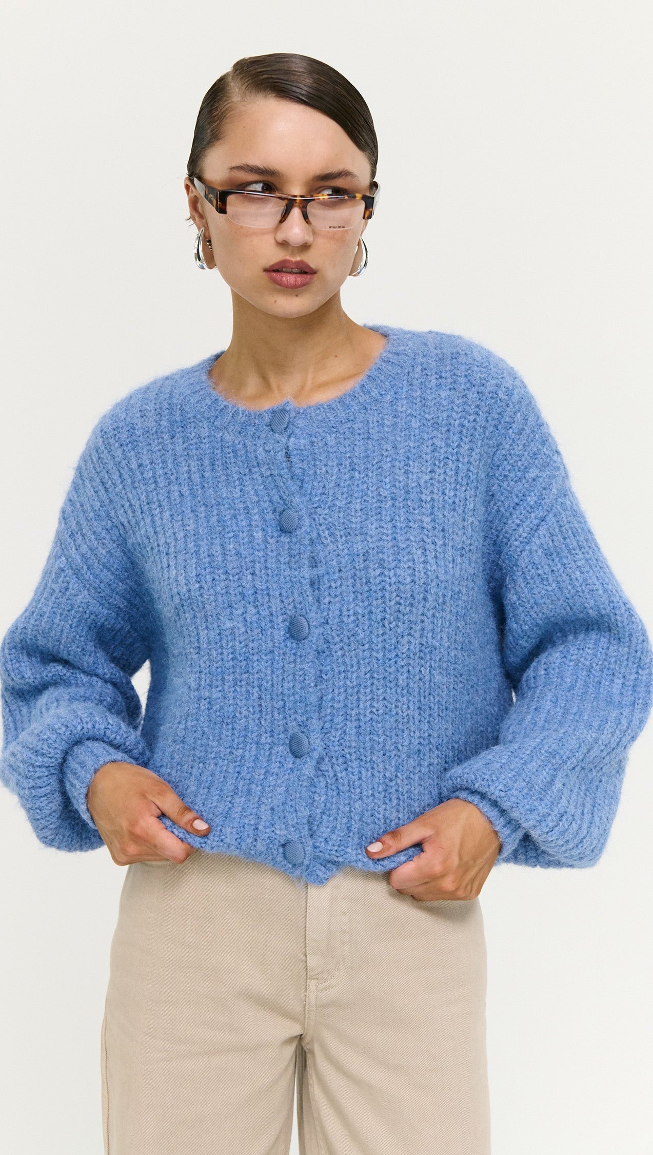 Soft Handle Ballon Sleeve Cardigan in Blue worn by model, featuring button details and a fluffy texture.