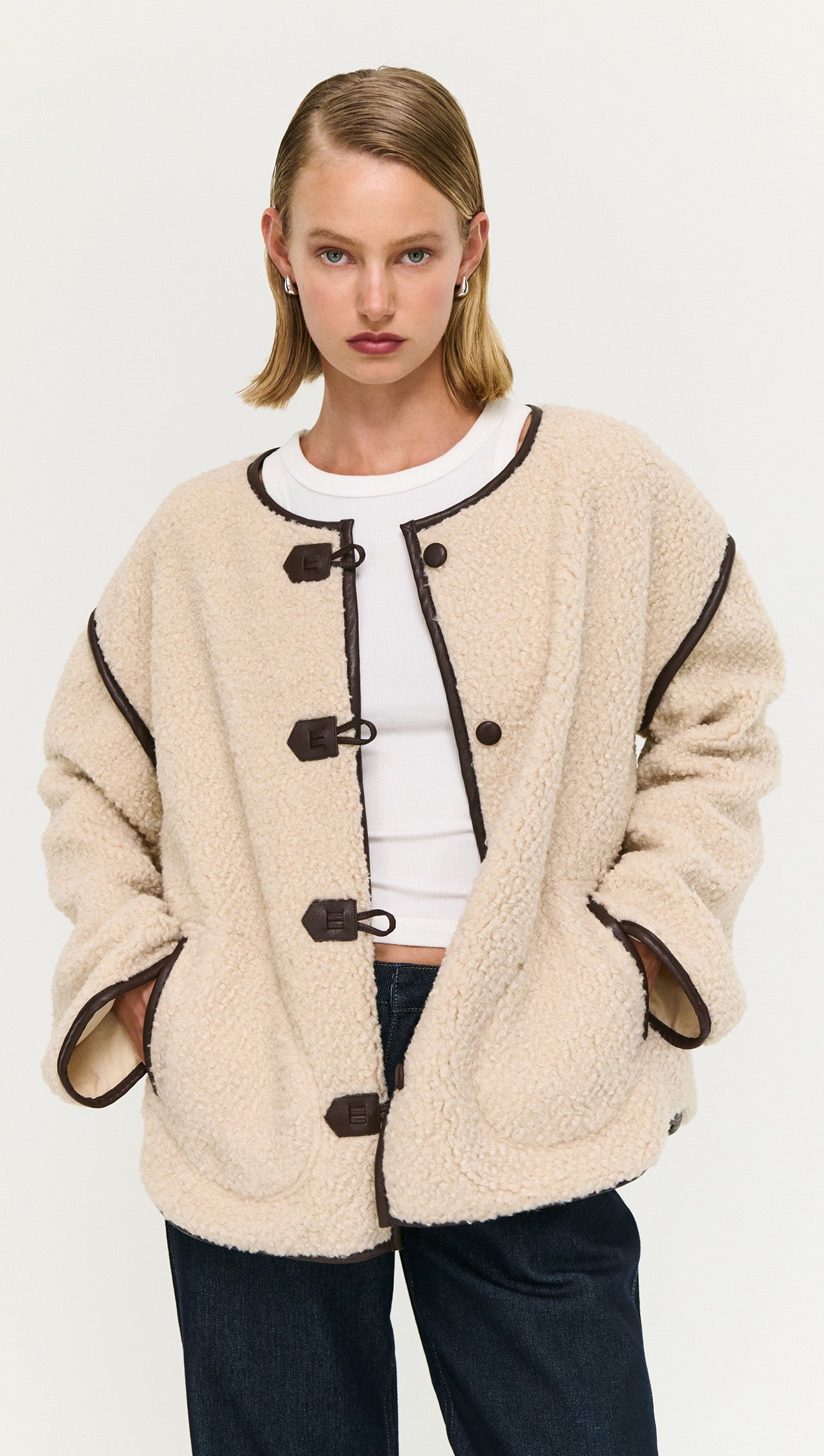 Brown Contrast Trim Duffle Coat in Teddy worn by a model, featuring a soft, cozy design with stylish button details.