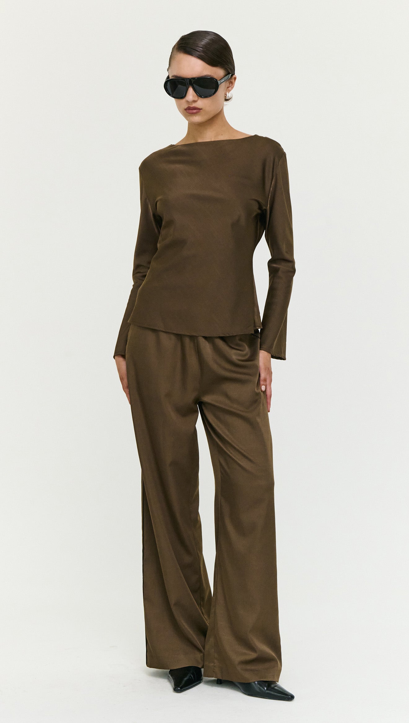 Model showcasing Espresso Relaxed Cut Silky Pant paired with a matching top and sunglasses.