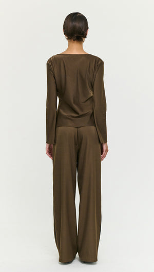 Back view of a model wearing the Espresso Bias Cut Boat Neck Top with coordinating pants, showcasing stylish, minimalist design.