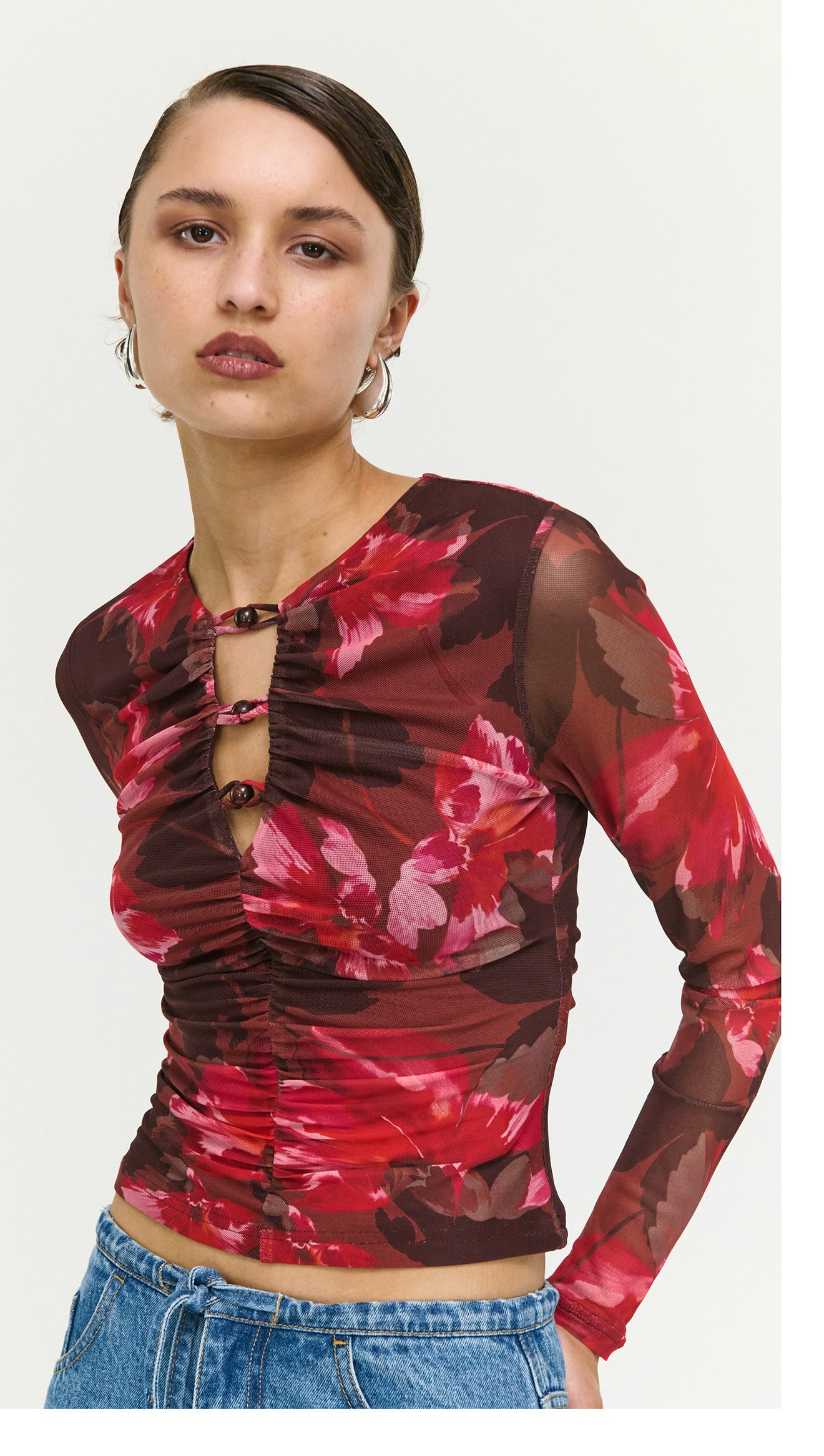 Pink Floral Print Mesh Bead Detail Top featuring a bold floral design and ruched detailing, perfect for stylish evening wear.