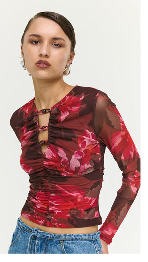 Pink Floral Print Mesh Bead Detail Top featuring a bold floral design and ruched detailing, perfect for stylish evening wear.