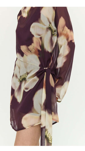 Sheer Floral Mini Dress with Tie Detail featuring elegant floral patterns and a stylish tie at the waist.