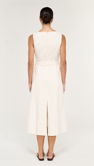 Back view of a woman wearing a Cotton Belted Wrap Midi Dress in Cream, showcasing the elegant design and slit.