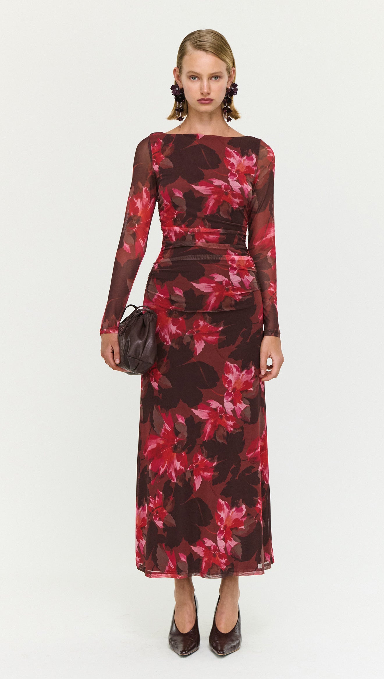 Ruched Pink Floral Mesh Midi Dress worn by a model, showcasing the elegant floral design and flattering silhouette.
