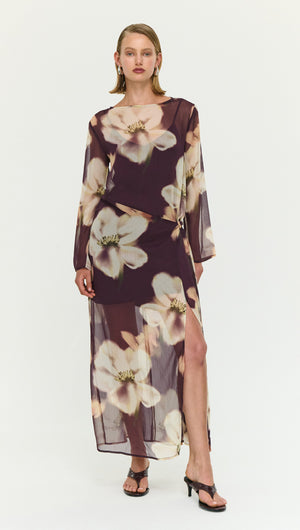 Sheer Floral Maxi Dress with Tie Detail showcasing a model in a floral print dress with a thigh-high slit.