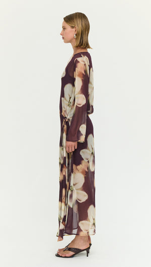 Sheer Floral Maxi Dress with Tie Detail shown in profile view, featuring a soft, romantic floral design and elegant silhouette.
