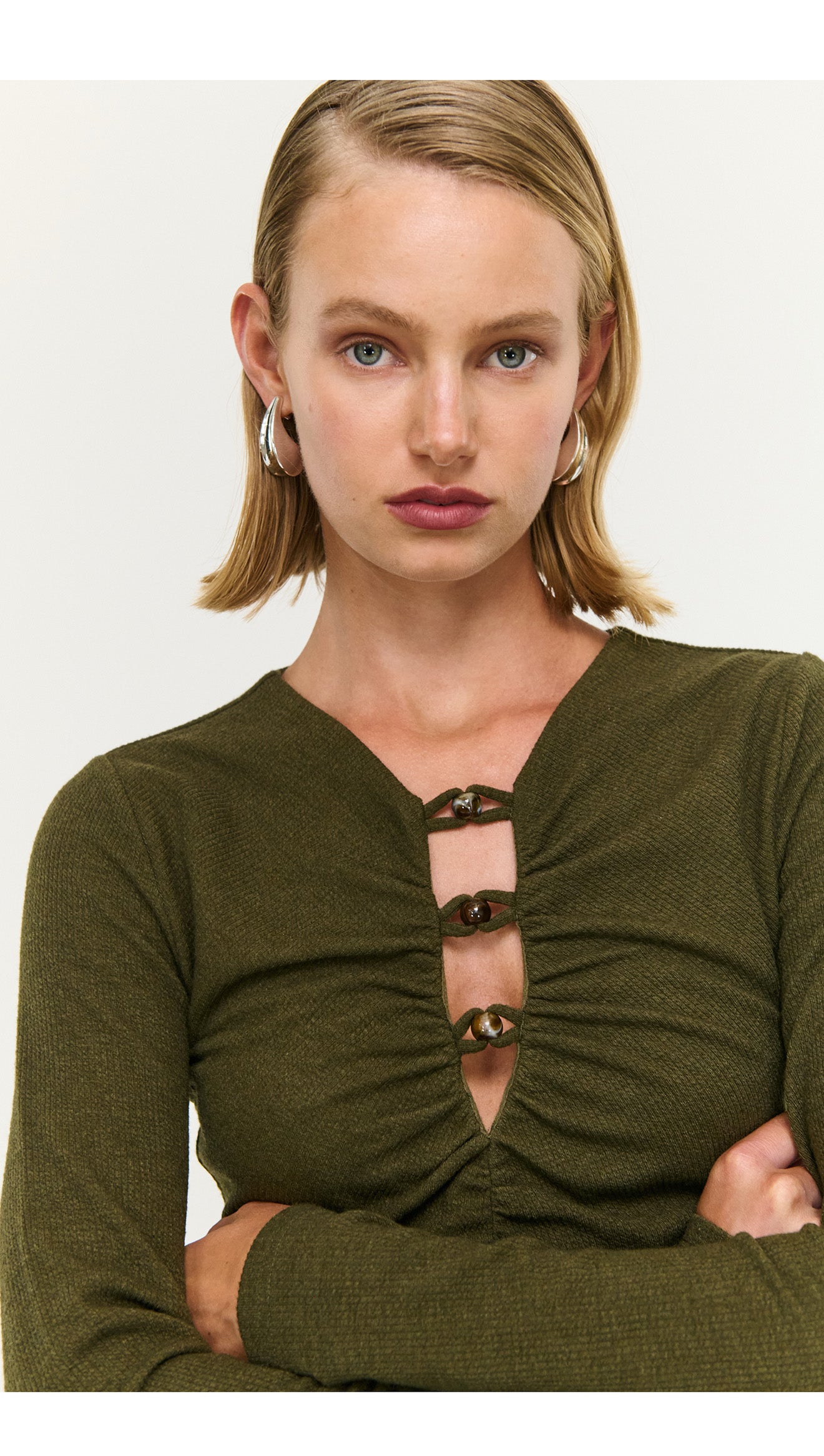 Olive Green Bead Detail Rib Midi Dress with long sleeves, ruched detail, and stylish accessories.