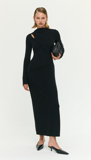 Model wearing a Black Asymmetric Seam Detail Midi Dress, showcasing unique cutouts and sleek silhouette.