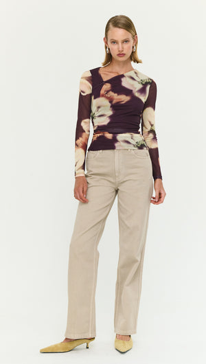 Model wearing Stone Wash Straight Leg Jeans with a floral long-sleeve top and stylish footwear.