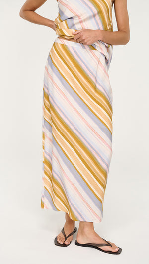 Model wearing Pastel Stripe Mid Rise Midi Skirt featuring soft colors and fluid movement.