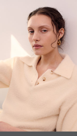 Fluffy Knit Polo Top in Cream worn by a model with natural makeup and earrings, showcasing a soft and cozy fabric.