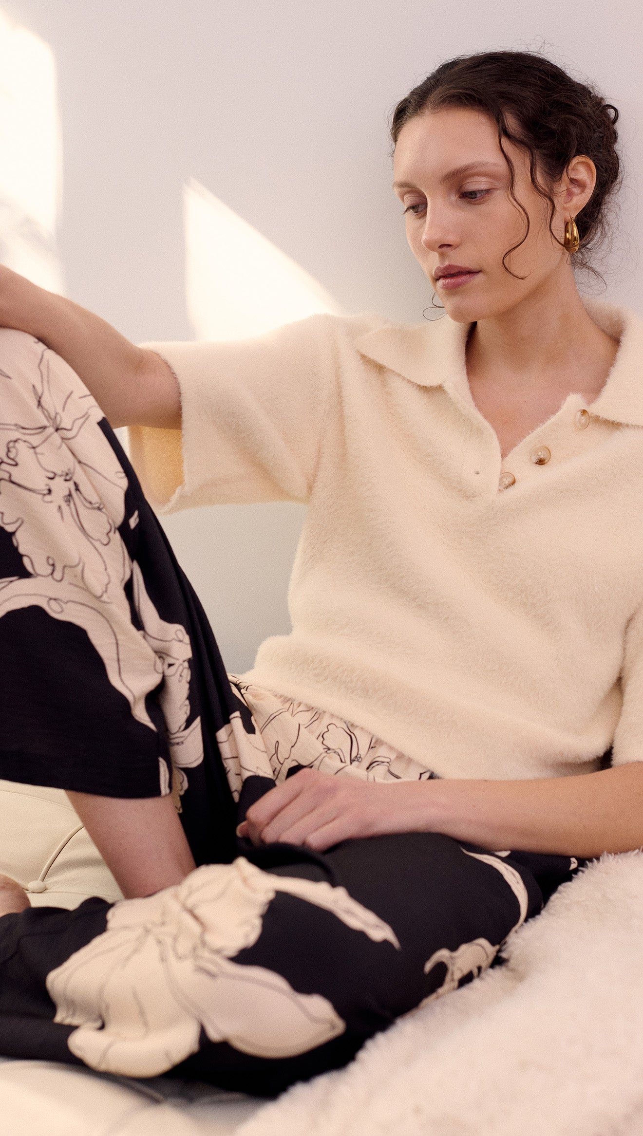Model wearing Sketched Floral Drawstring Pant paired with a cream sleeveless top, showcasing an elegant floral design.