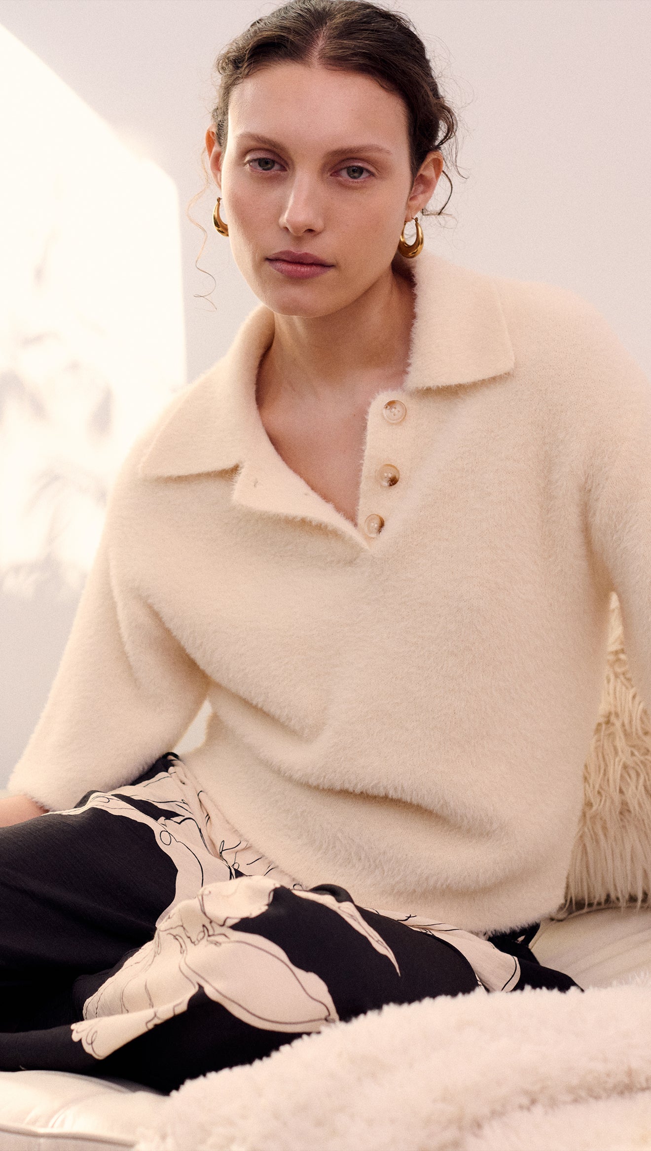 Fluffy Knit Polo Top in Cream worn by a model with natural makeup and earrings, showcasing a soft and cozy fabric.
