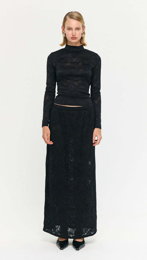 Black Sheer Lace Long Sleeve Top showcased with a matching skirt, elegant styling featuring intricate lace details.