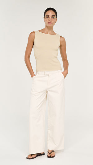 Fine Rib Knit Reversible Tank in Ecru worn with wide-leg white pants and sandals, showcasing a stylish outfit.