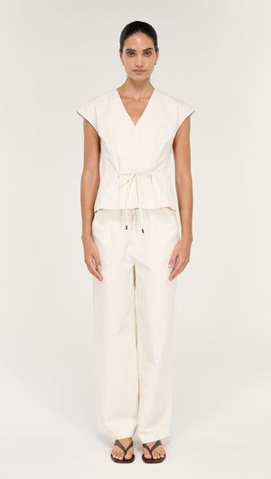 Cotton Tie Front Top with Cap Sleeve worn with matching pants, showcasing a modern and stylish outfit.