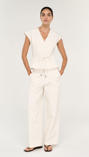 Relaxed Cotton Wide Leg Pant in Cream worn with a matching top, showcasing a modern and stylish outfit.