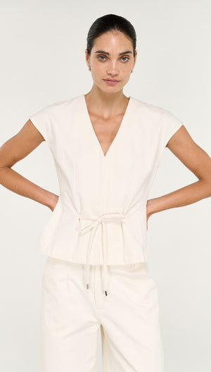 Cotton Tie Front Top with Cap Sleeve displayed on a model, featuring a v-neck and tie detail, styled with matching bottoms.
