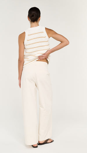 Cotton Blend Stripe Knit Tank in White worn by a model from the back, styled with wide-leg pants.