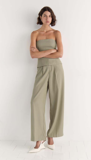 Model wearing neutral beige Margot Wide Leg Pant with a relaxed fit and high-rise waist, styled with a matching bodice top.