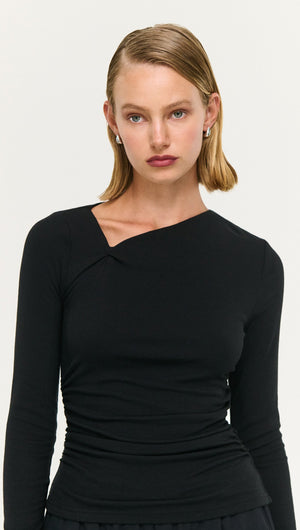 Model wearing a Black Soft Jersey Twist Neck Top showcasing its stylish design and soft stretch fabric.