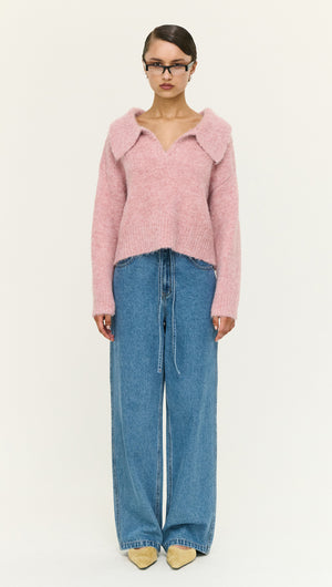 Dusky Pink Fluffy Knit Polo Jumper worn with wide-leg denim jeans, featuring a cozy collar and relaxed fit.