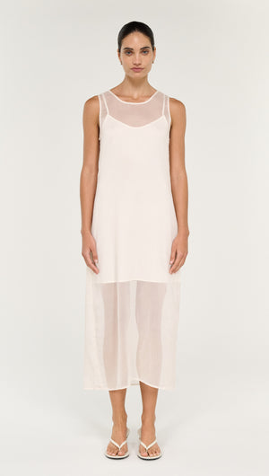 Sheer Layered Slip Midi Dress in Cream displayed on a model, featuring a transparent layered design and elegant silhouette.