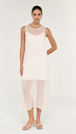 Sheer Layered Slip Midi Dress in Cream featuring a model wearing a transparent layered design, perfect for elegant occasions.