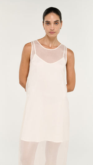 Sheer Layered Slip Midi Dress in Cream worn by a model, showcasing its elegant design and transparent layers.