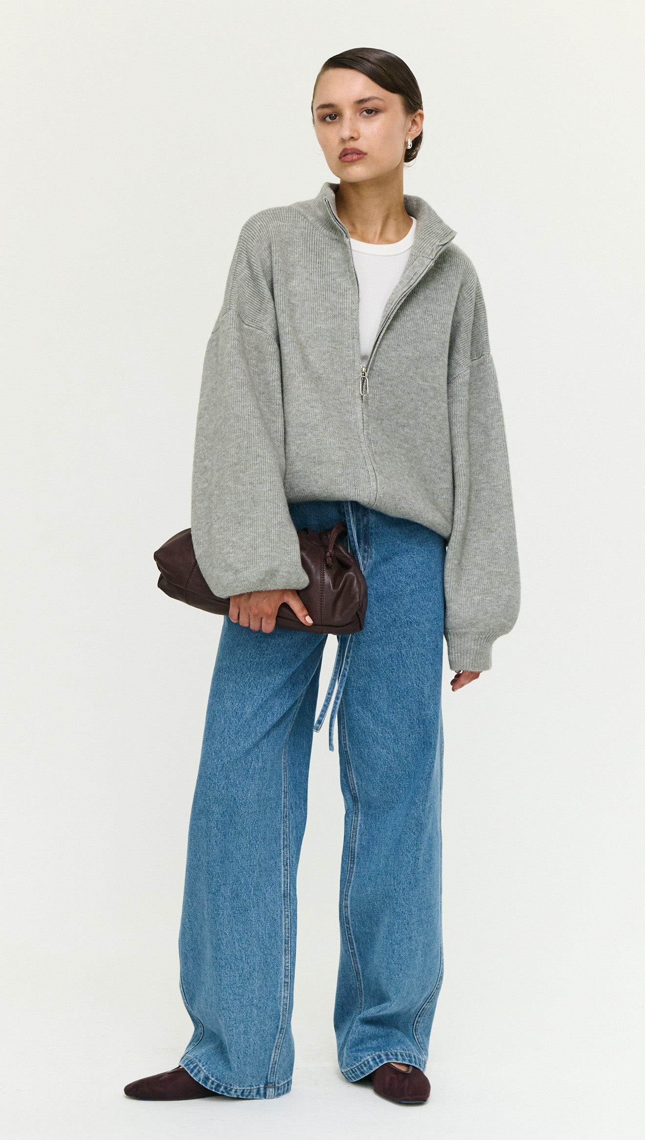Soft Grey Oversized Zip Cardigan worn by model, showcasing a cozy and stylish look with a zip closure.