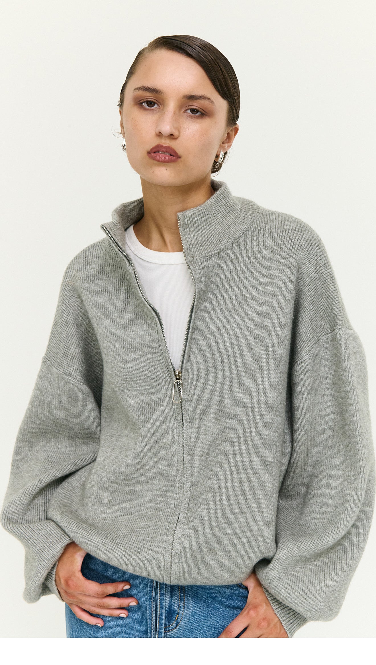 Soft Grey Oversized Zip Cardigan worn by model, showcasing a cozy and stylish look with a zip closure.