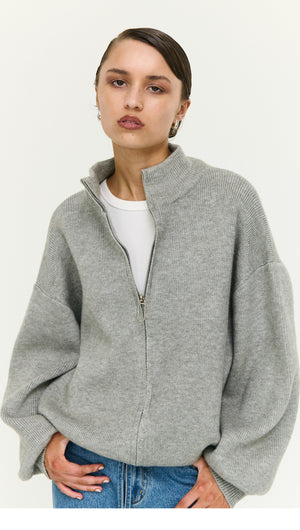 Soft Grey Oversized Zip Cardigan worn by model, showcasing a cozy and stylish look with a zip closure.