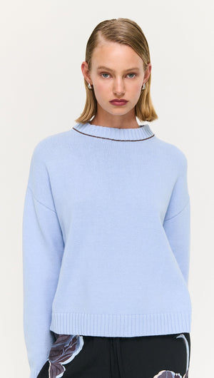 Blue Cotton Blend Contrast Seam Jumper worn by a model, showcasing its stylish and cozy design.
