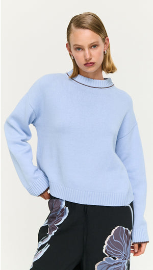 Blue Cotton Blend Contrast Seam Jumper styled with floral print pants on a model.