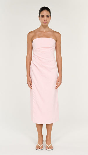 Model wearing a Strapless Wrap Midi Dress in Soft Pink, showcasing a sleek, elegant design perfect for special occasions.