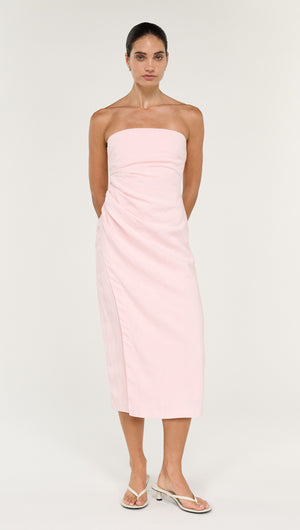 Strapless Wrap Midi Dress in Soft Pink worn by model, showcasing elegant design and feminine silhouette.