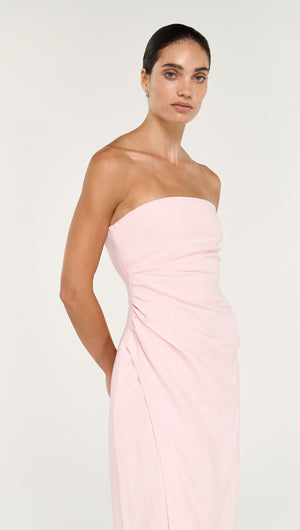 Strapless Wrap Midi Dress in Soft Pink displayed on a model with a sleek hairstyle and an elegant pose.