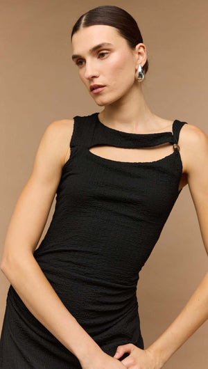 Model wearing a black cut out ruched A-line midi dress with bead detail, showcasing elegance and style.