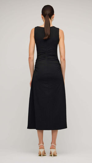 Back view of a Black Cut Out Ruched A-Line Midi Dress showcasing bead detail and sleek fit.