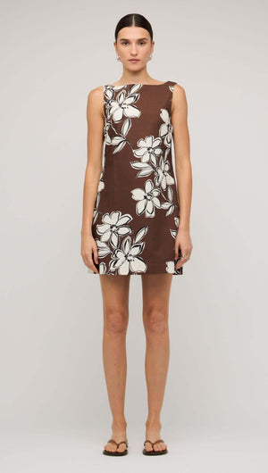 Brown and white cotton floral shift mini dress on a model, showcasing a playful yet polished summer style.