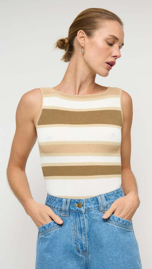 Model wearing a Reversible Stripe Knit Tank paired with denim shorts, showcasing its stylish wide stripe design.